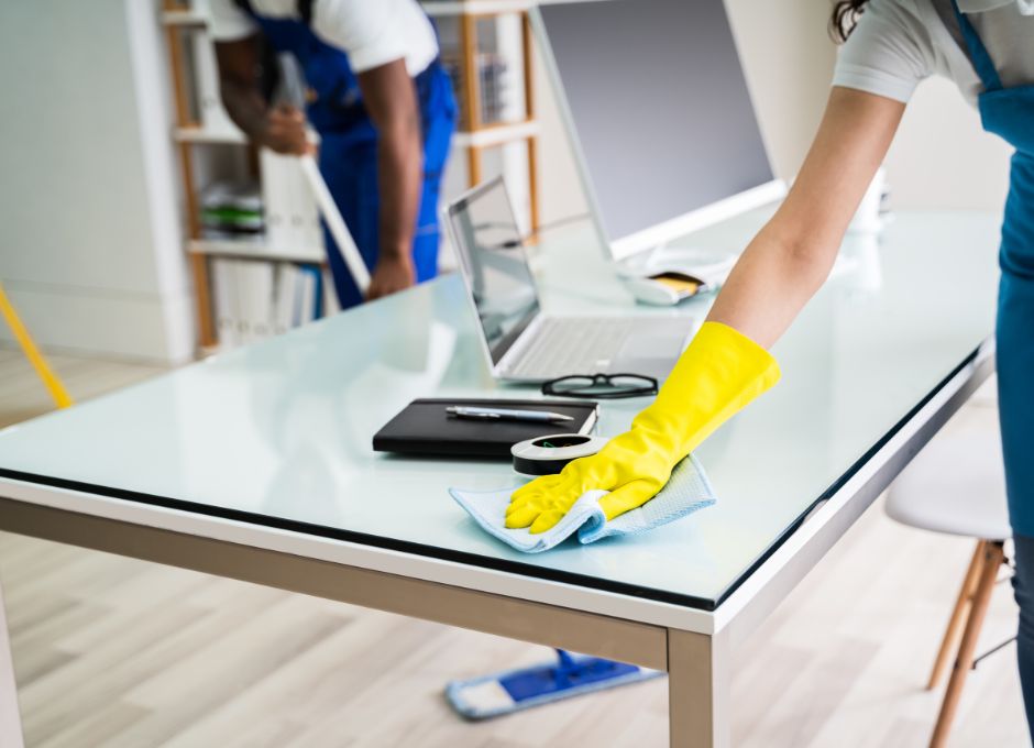 house cleaners mopping and polishing desk