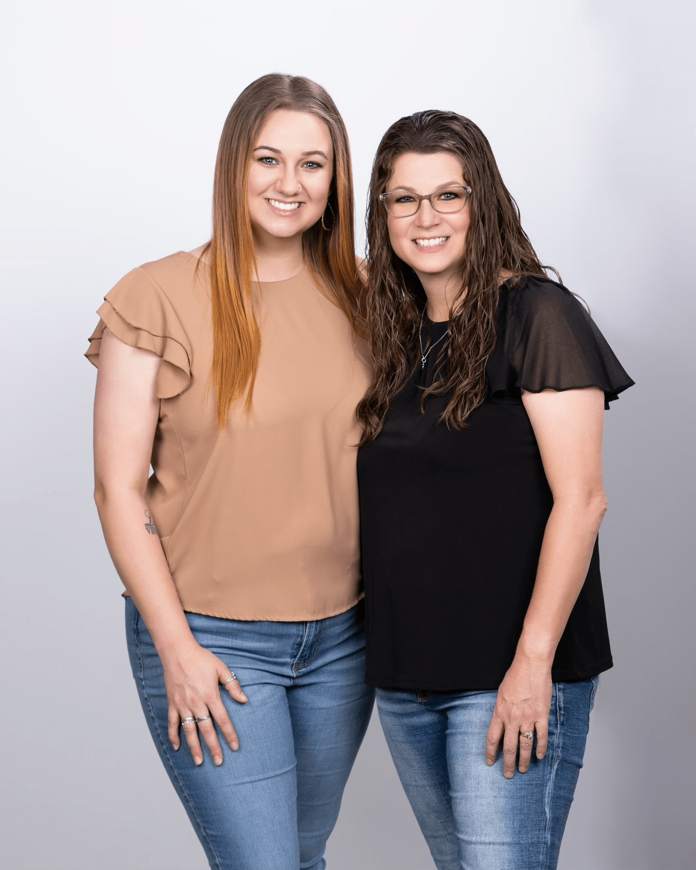 Owner, Amanda Holt, and daughter standing for portrait