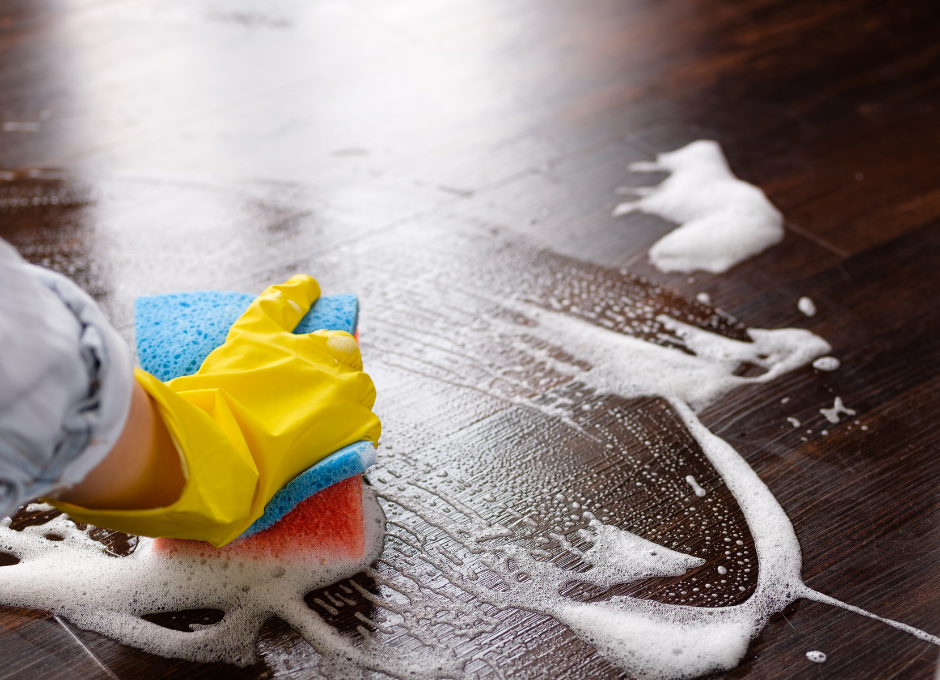 close up of hand cleaning floor