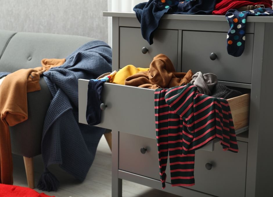 messy room with laundry