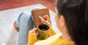 woman with coffee planning new years goals