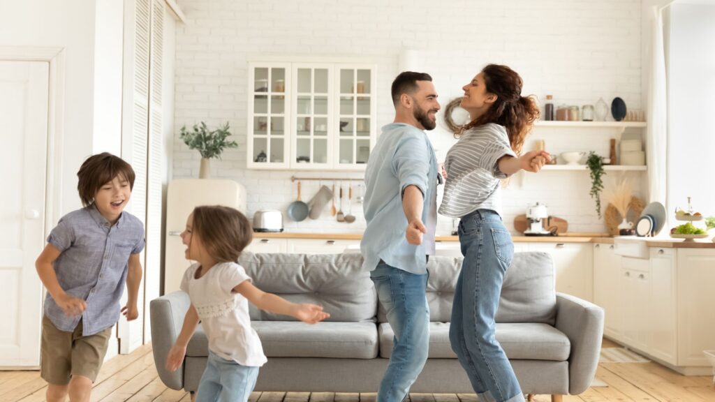 family dancing in home