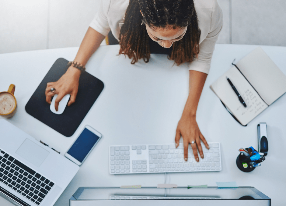 woman sitting at desk with computer