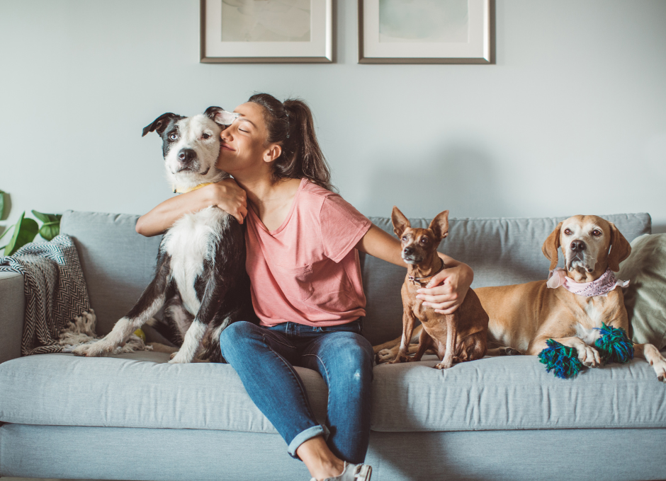 woman loving on her dogs