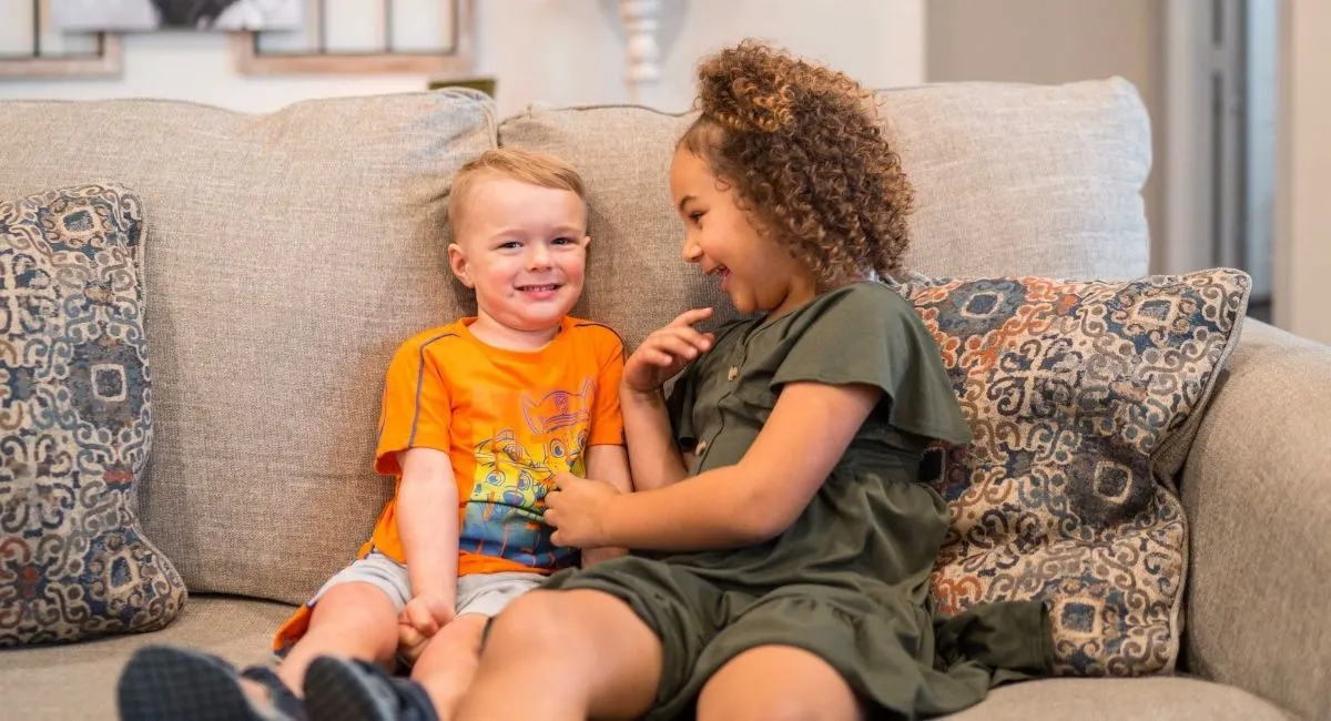 kids sitting on sofa